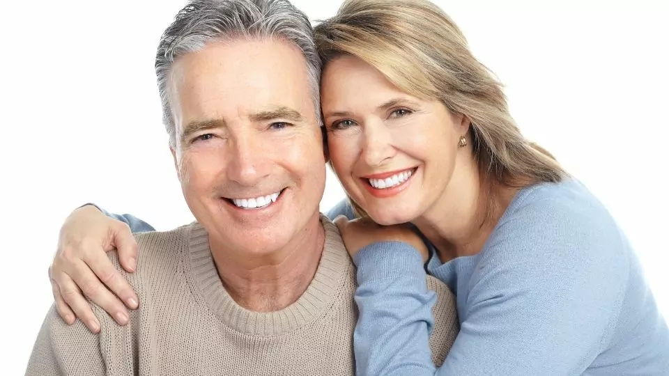 A Happy Couple After Getting Dental Implant Treatment