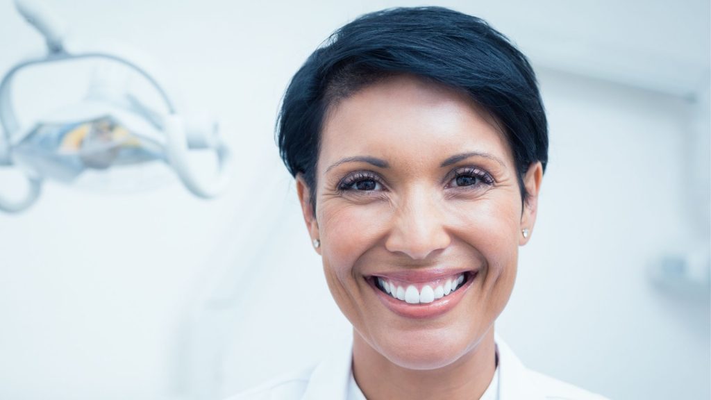 A Female Dentist With A Bright Smile