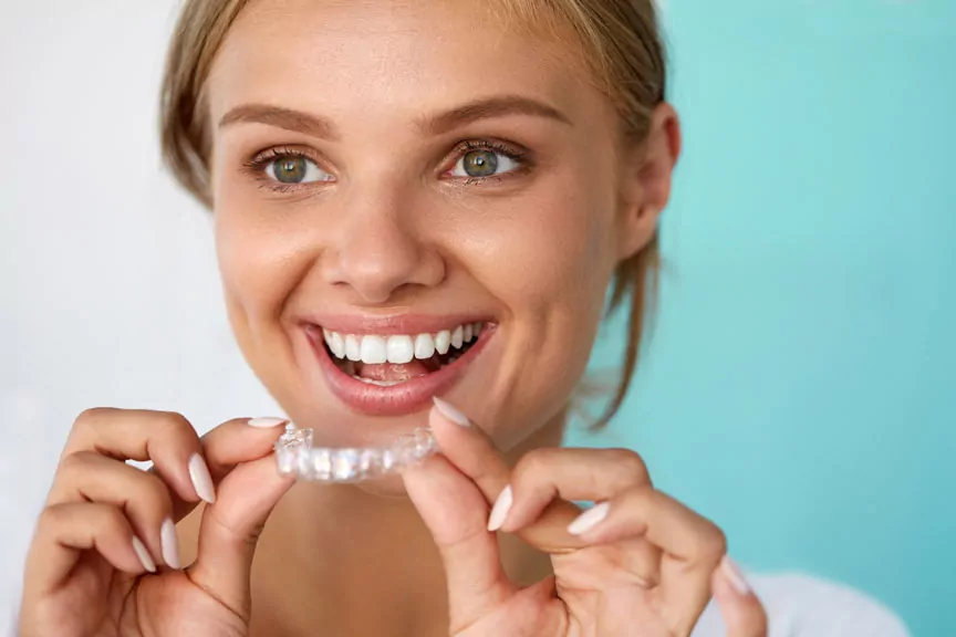 Woman Holding An Invisalign