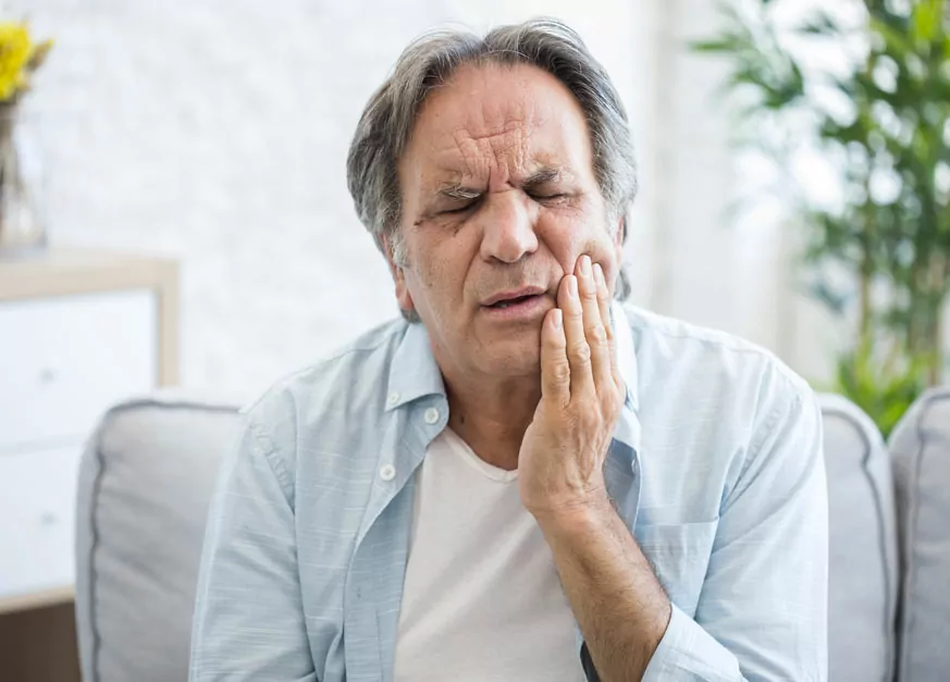 Elderly Person Suffering From Canker Sores In Toronto, ON
