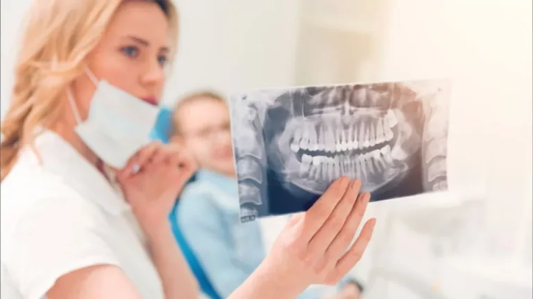 Dentist Holding An X-ray Of Teeth