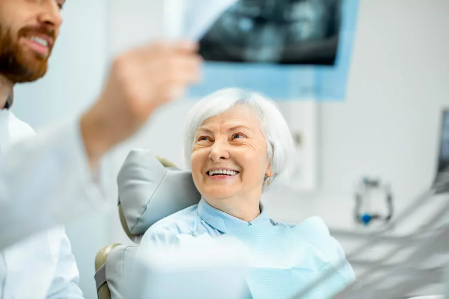 A Senior Patient Sitting For Denture Appointment